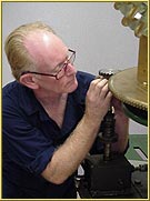 Lighthouse Consultant Jim Woodward adjusts the drive gear during the restoration of the Old Mackinac Point Fourth Order Fresnel lens. Click to view enlarged image.