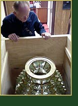Lighthouse Consultant Jim Woodward crating the Old Mackinac Point 4th Order lens for shipment back to Mackinaw City. Click to view enlarged image